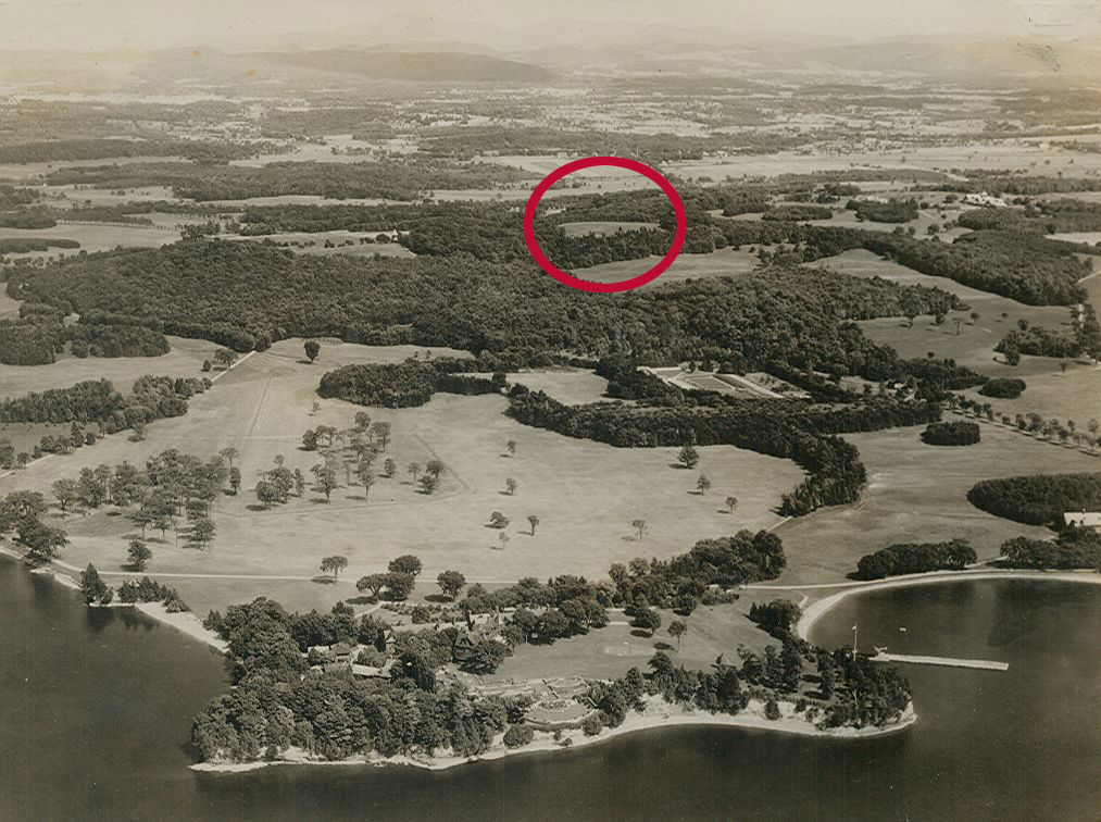 Aerial photo of Shelburne Farms looking from Lake Champlain east to the Green Mountains