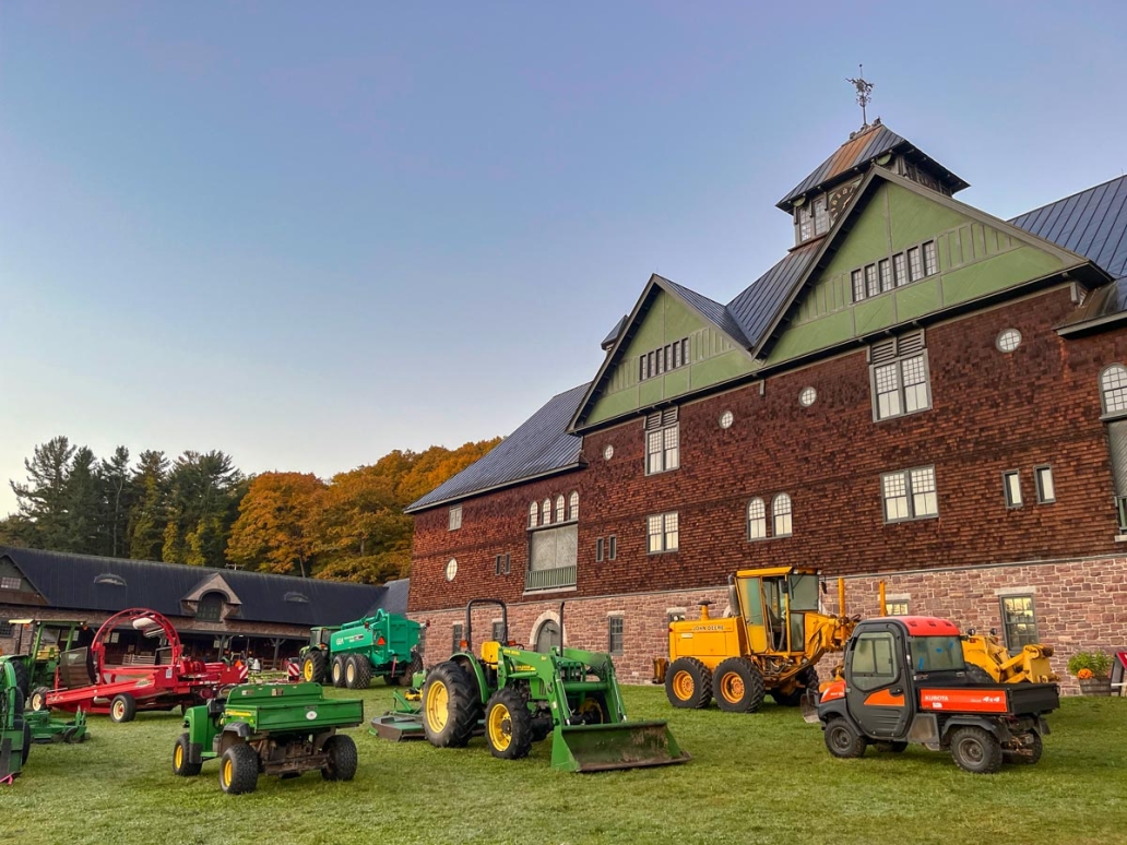 A large courtyard filled with various agricultural machines