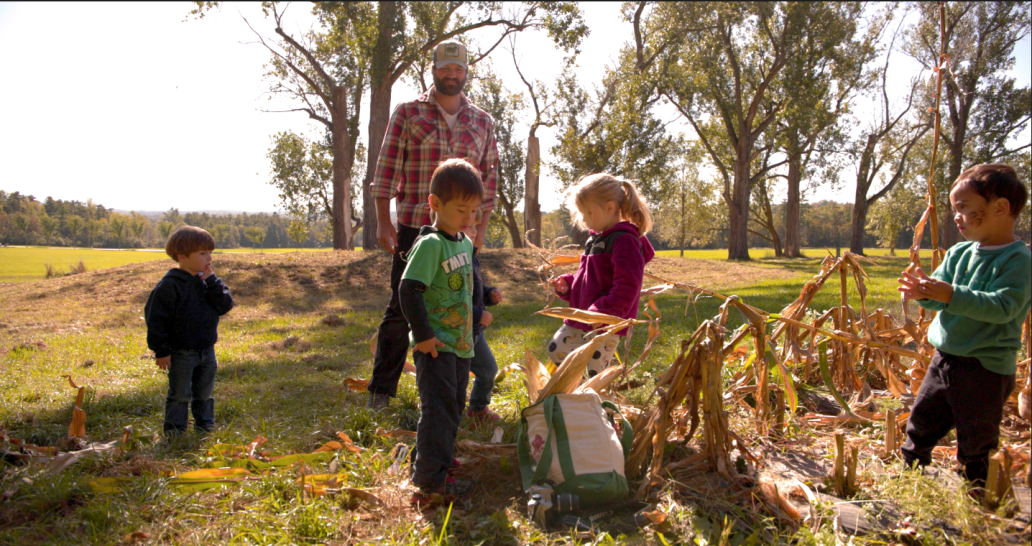 kids harvesting corn