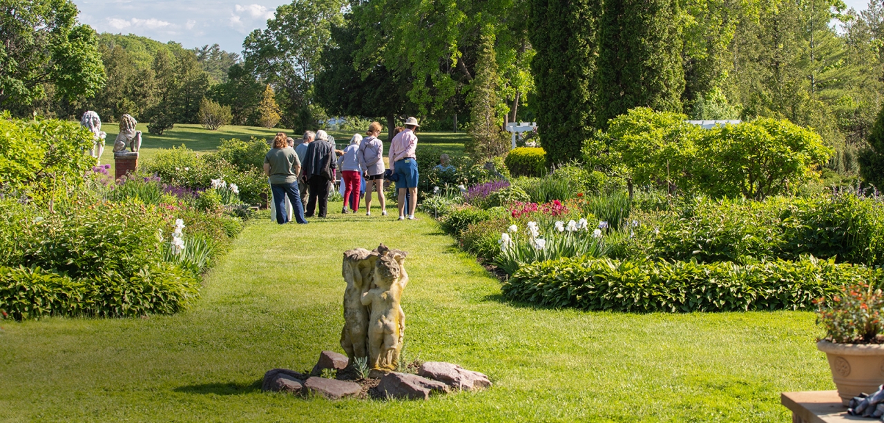 Flower Gardens with people walking down grassy path