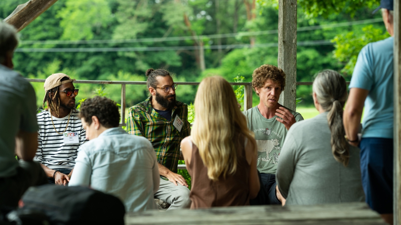 Educators gather in an outdoor learning space in the Shelburne Farms Market Garden