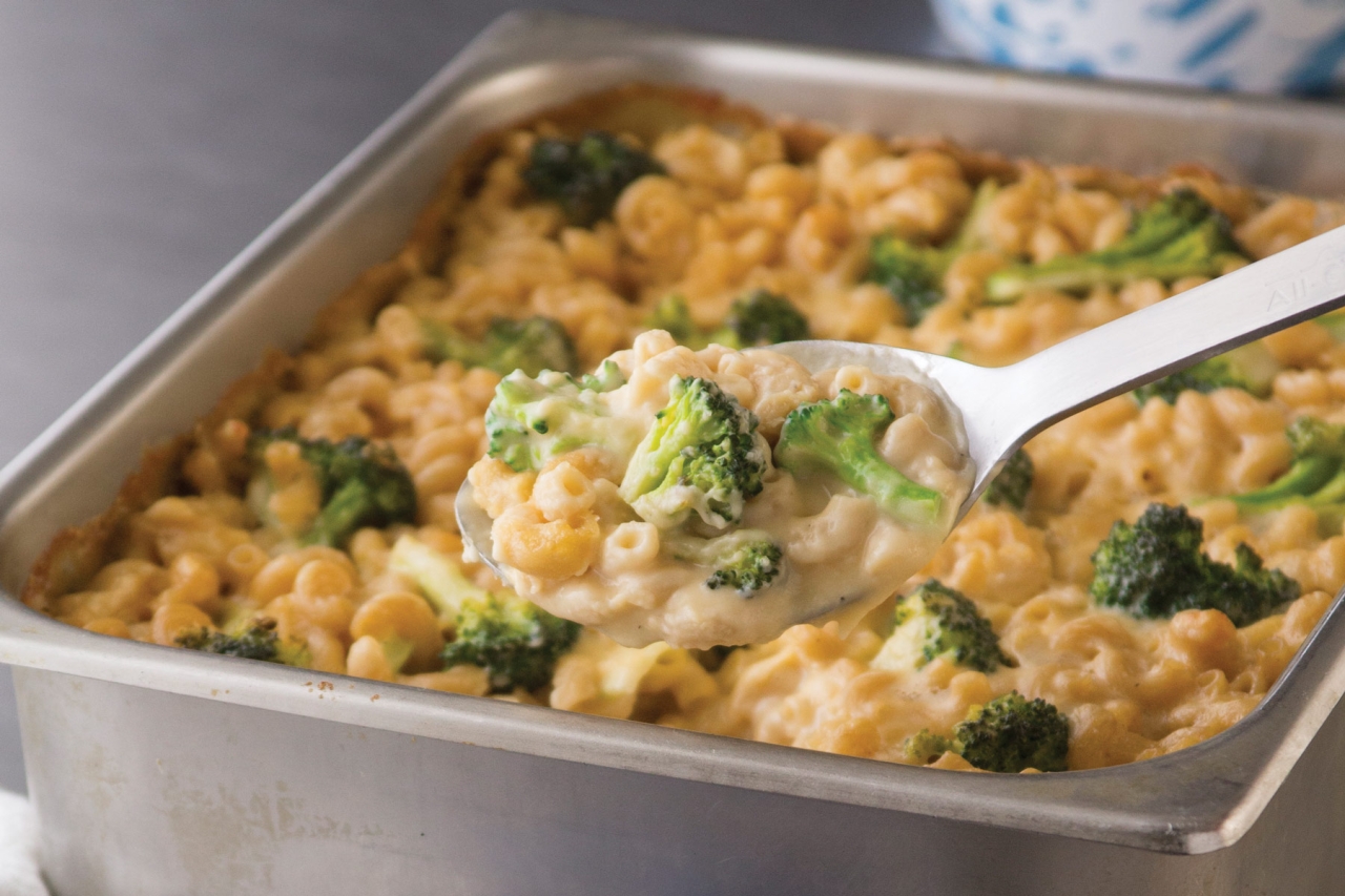 A pan of macaroni and cheese with broccoli