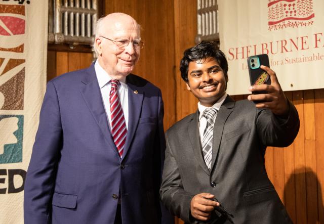 Senator Leahy and a student pose for a selfie.