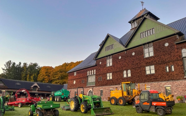 A large courtyard filled with various agricultural machines