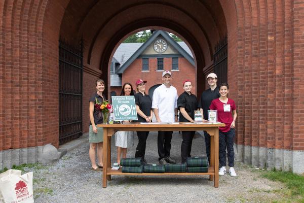 Portrait of Inn kitchen staff in front of the Coach Barn, ahead of a Vermont Fresh Network picnic