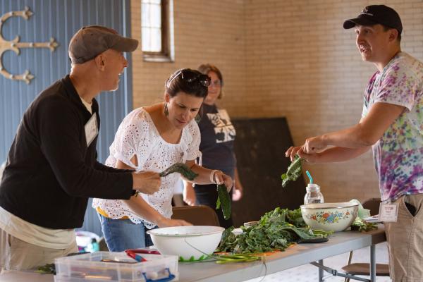 Participants make kale pesto together during the workshop, âThe Nuts and Bolts of Integrating Local Food into your Menu.â