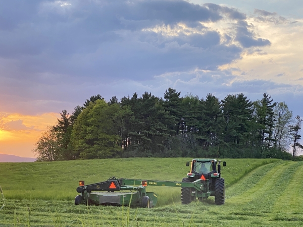 Mowing. To get all the harvest in on time (and before the rains), mowing happens well into the twilight hours on many evenings. (Wally Allen)