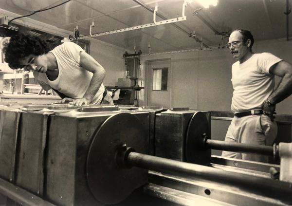 Marshall Webb and Bill Clapp pressing hoops to make cheddar in the 1980s