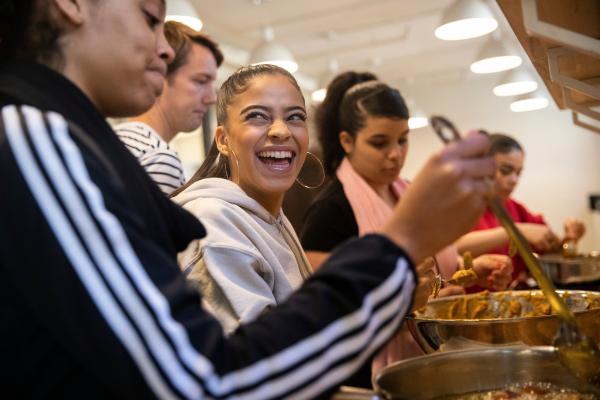 HSES students cooking. Photo sourced from New York Times, December 2019.
